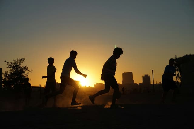A game going on as the sun goes down